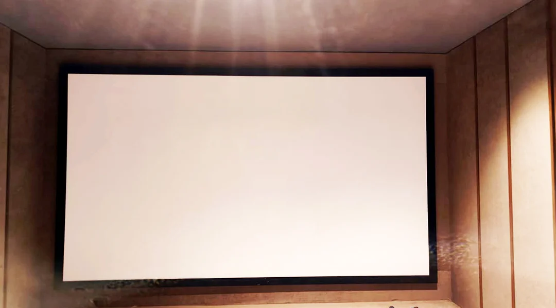 Completed project by Lumina Screens showcasing a high-performance AV screen installed in a modern home theater setup